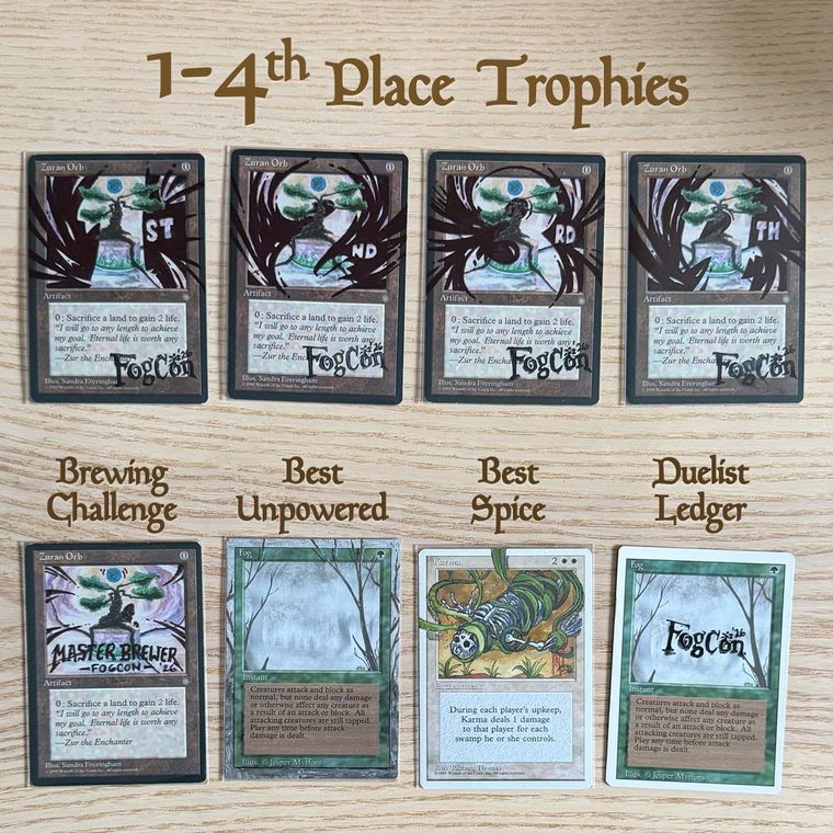 The eight hand-altered FogCon '26 prize cards: four Zuran Orb trophies, a Master Brewer Zuran Orb, an extended-art Fog, an altered Karma, and a FogCon-stamped Fog